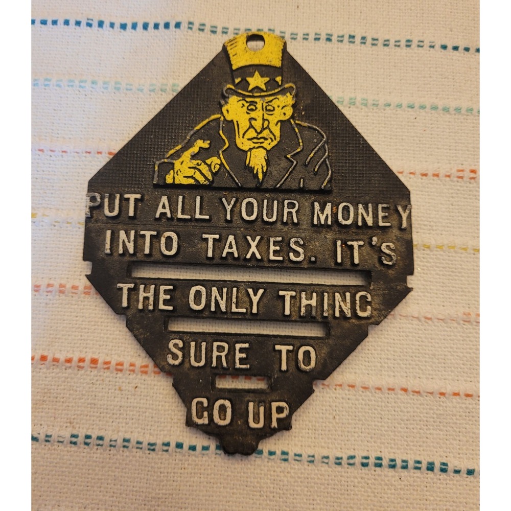 Black Iron Trivet Vintage " Put all your Money in Taxes, its the only thing..